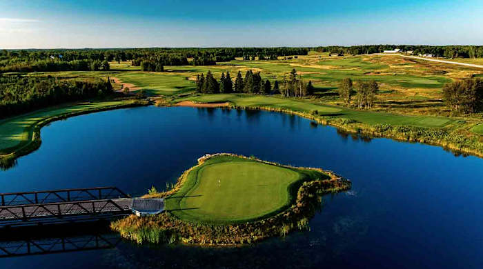 The island 15th hole at Sweetgrass Golf Club